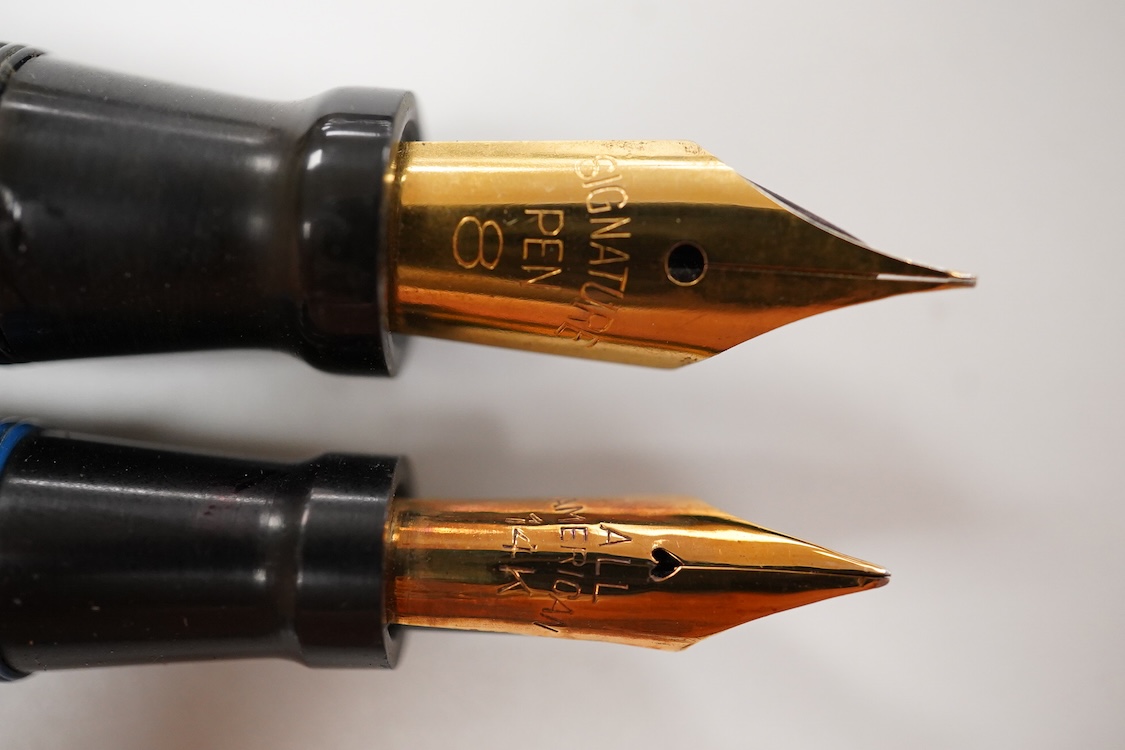 Two Conklin Enoura fountain pens in lapis blue (Senior) and a pale blue example